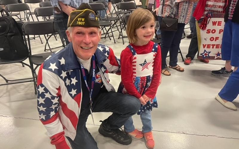 Photo by Maureen Moss Dwight Moss greeted a young patriot during an Honor Flight celebration in Asheville on Saturday April 27.