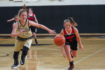 (Kelli Graves  • Clay County Progress) Mallory Peck chases down a Lady Wildcat for a steal in Hayesville’s impressive win.