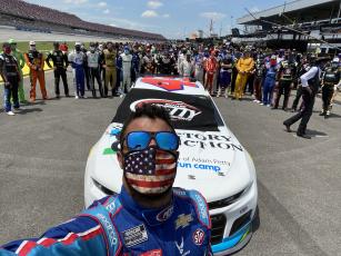 (@bubbawallace • Twitter) Bubba Wallace snaps a picture as fellow drivers and crew members show support for the Alabama native.