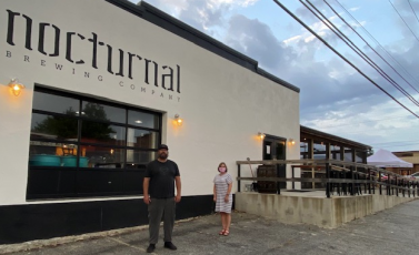 •Curt Wheeler Mike Plummer, owner of Nocturnal, gave Sherry Adams, of the North Carolina Department of Commerce, a tour of his building which was renovated with help from the Solutions Fund available through North Carolina Small Town Main Street.