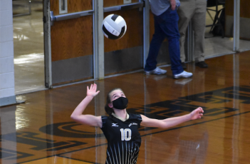 (Kevin Hensley • Graham Star) Ava Shook takes flight for one of her four ace serves against Robbinsville.