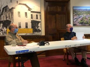 (Lorrie Ross•Clay County Progress) Mayor Harry Baughn and Councilman Joe Slaton discuss the new parking stripes and lights for town