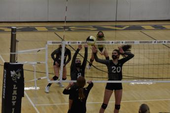 (Travis Dockery • Clay County Progress) The duo of Emma Shook, No. 8 and Hallie Johnson, No. 20 successfully block an attack attempt from a Lady Wildcat