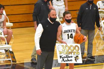 (Travis Dockery • Clay County Progress) Coach Mike Cottrell takes a moment to recognize Kolbe Ashe’s 1000th point accomplisment. Ashe would go on to have a career-high 34 points in the playoff game win.