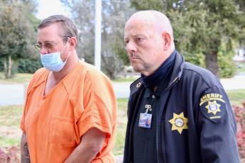 Charles Jason Matheson waived extradition to Georgia from Clay County and is being escorted to the Towns County Courthouse by Towns County Sheriff Kenneth Henderson. 