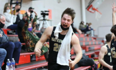 (Kelli Graves • Clay County Progress) Senior Blake McClure celebrates his teams success from the bench.