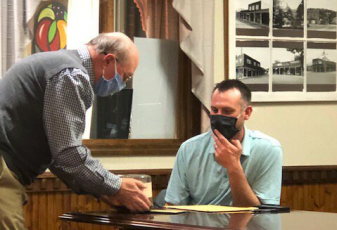 Lorrie Ross • Clay County Progress Hayesville Town Councilman Will Penland attended his last council meeting as a councilman. He is moving outside of town and gave his resignation. Mayor Harry Baughn presented a small cake to Penland, along with a card.