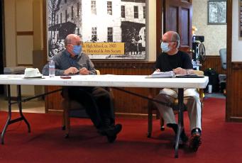 (Jared Putnam• Clay County Progress) Hayesville Mayor Harry Baughn, left, speaks with town council member Joe Slaton during the monthly meeting on May 10.