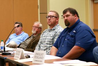 Clay County Commissioners Scotty Penland, Clay Logan, Rob Peck and Randy Nichols listen as Clay County Attorney Merinda Woody explains the details of the Residential Park Development Ordinance during a hearing on May 6 in Hayesville.