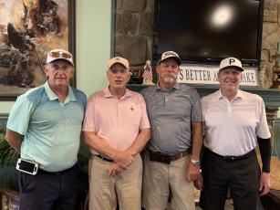 Gross winners, from left, Benny Parten, Woody Chastain, Jerry Brinke and Jimmy O’Brien stand shoulder-to-shoulder as the top team.