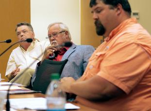Jared Putnam • Clay County Progress From left, Clay County Commissioners Scotty Penland, Clay Logan and Randy Nichols listen as County Attorney Merinda Woody speaks during the monthly board meeting on Thursday, June 3 in Hayesville.