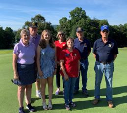 From left, Elizabeth Davis, Patrick Davis, Allison Thomas, Marsha Christy, Teresa McClure, Dwight McClure and Carl Maxwell help out with the golf tournament.