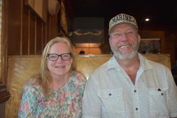 Jim and Judy McKeral, veterans of the U.S. Marine Corps, enjoy lunch            at a local restaurant and recount their years serving the country.