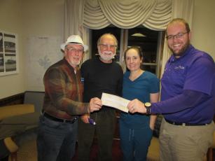 Mayor Harry Baugh, Councilman Joe Slaton, Councilwoman Lauren Tiger and Councilman Austin Hedden (L-R) are donating their financial “token of appreciation” checks to charity. The Town Council offered all citizens who can provide proof they are town residents and have been vaccinated against the Covid-19 virus a check for $100. As of Monday, 107 checks had been issued.