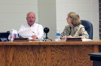 (Jared Putnam * Clay County Progress) Robert Caldwell, Vice-Chairperson of the Clay County Board of Education, and board member Reba Beck talk during the Clay County Board of Education meeting on Monday in Hayesville. The board approved the creation of a "nondiscrimination" resolution similar to ones passed by Cabarrus County Schools and Wayne County Schools earlier this year in response to public fears over Critical Race Theory.