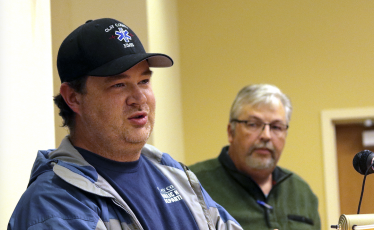 (Jared Putnam / Clay County Progress) Clay County Community Paramedic Ben English speaks while fellow paramedic Jeff Ledford looks on during the Clay County Board of Commissioners meeting on Nov.4 in Hayesville.