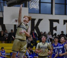 Payton Mcgaha sails to the basket for two points.
