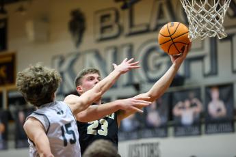 Kelli Graves • Clay County Progress Jake McTaggart a sinks basket to add to his 17 points for Jackets.