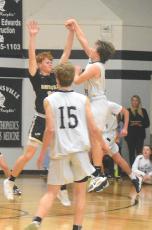 Hayesville's Peyton McGaha plays perfect defense as Robbinsville attempt the final shot of the game.