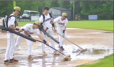 Gary Corsair • Clay County Progress Dakota Matheson, Chance Hughes, Avery Leatherwood and Kyle Lunsford dry the Scott D. Penland Field skin after a downpour halted Friday’s playoff game with Eastern Randolph. Players, coaches and ground crew did a remarkable job of restoring the diamond with an assist from A+ Lawn Care, but it was decided to continue the game Saturday. 