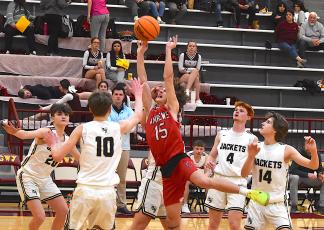 Gary Corsair • Clay County Progress Hayesville JV boys coach Zach Cottrell watches his troops swarm an Andrews shot. From left is Daemien Soto, No. 20; Brandon Lynch, No. 10, E.J. Abrams (behind shooter), Peyton McGaha, No. 4, and Brady Reynolds, No. 14.