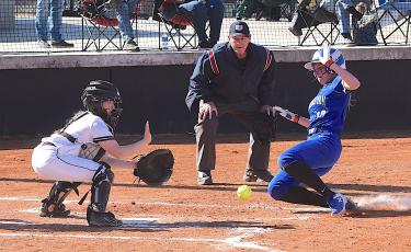 Gary Corsair • Clay County Progress Hayesville catcher Callie Long blocks the plate and reaches for the ball as a Hiwassee Dam runner attempts to score.