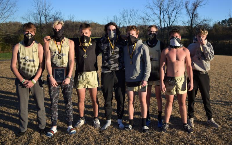 (Zach Moss • Submitted) Hayesville’s Yellow Jackets stand tall following their season-opening win. From left, Bryan Davenport, Ryelan Snowden, Eli Roberts, Paul White, Landon Hughes, Cameron Gray, William Wimpey and Dawson Coats.