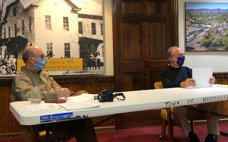 (Lorrie Ross•Clay County Progress) Mayor Harry Baughn and Councilman Joe Slaton discuss the new parking stripes and lights for town