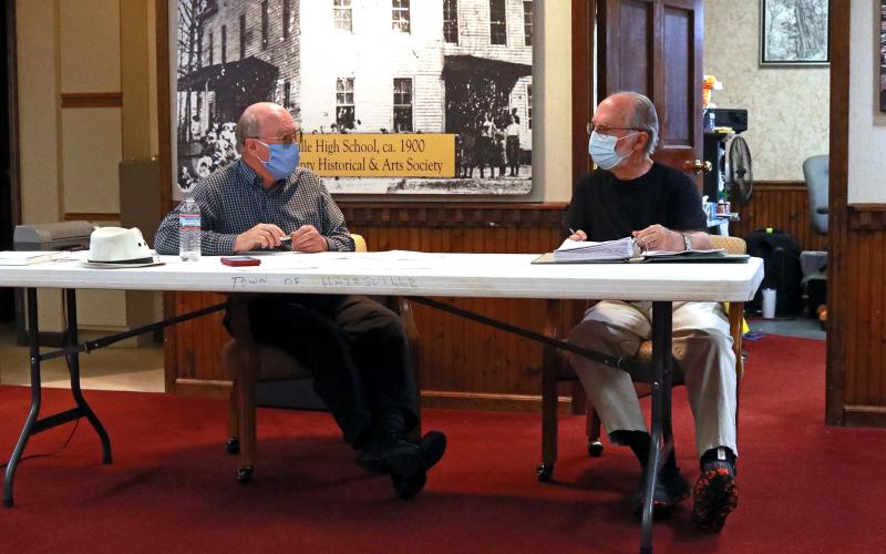 (Jared Putnam• Clay County Progress) Hayesville Mayor Harry Baughn, left, speaks with town council member Joe Slaton during the monthly meeting on May 10.
