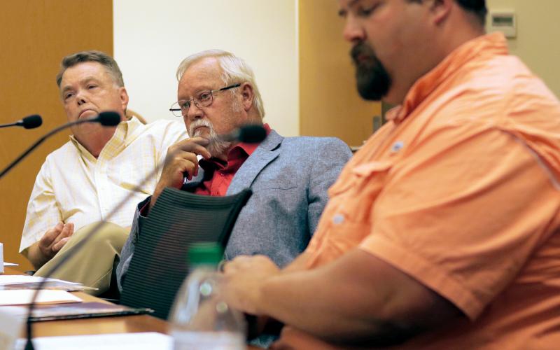 Jared Putnam • Clay County Progress From left, Clay County Commissioners Scotty Penland, Clay Logan and Randy Nichols listen as County Attorney Merinda Woody speaks during the monthly board meeting on Thursday, June 3 in Hayesville.