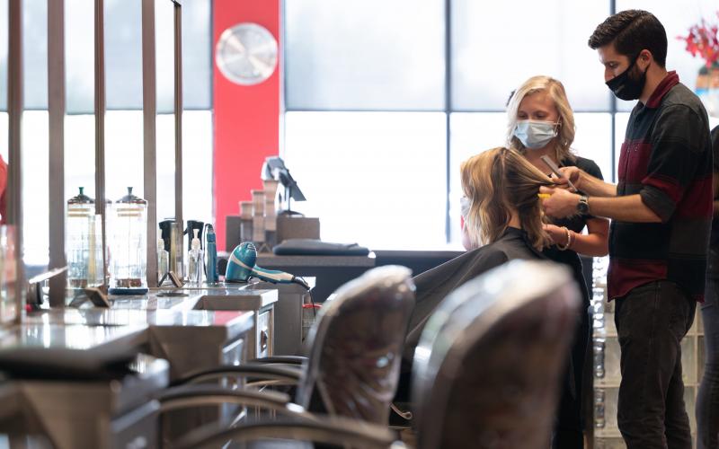 Students practice at Alexander Paul Institute of Hair Design. (Photo by Maya Reagan, Carolina Journal)