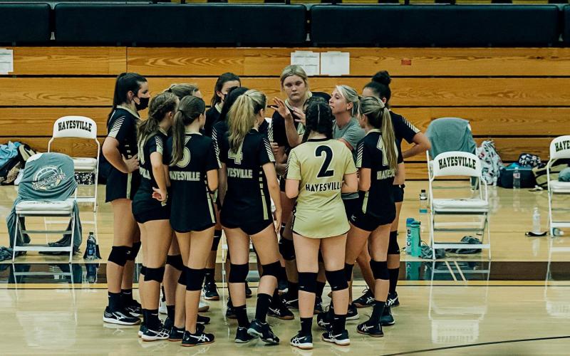 (Photo Submitted) Coach Laurie Shook gives her team instruction during a timeout in Hayesville's win over Cherokee. 