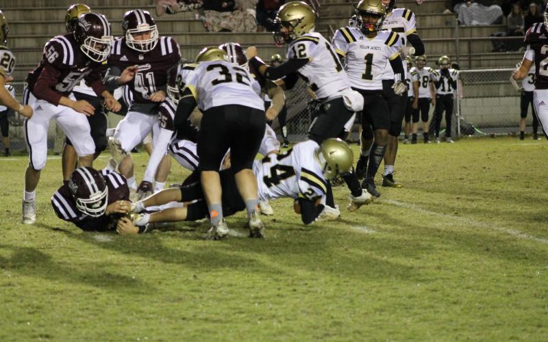 Hannah Styles Herrin • Smoky Mountain Times Freshman Michael Mauney lunges forward for positive yardage against Swain.
