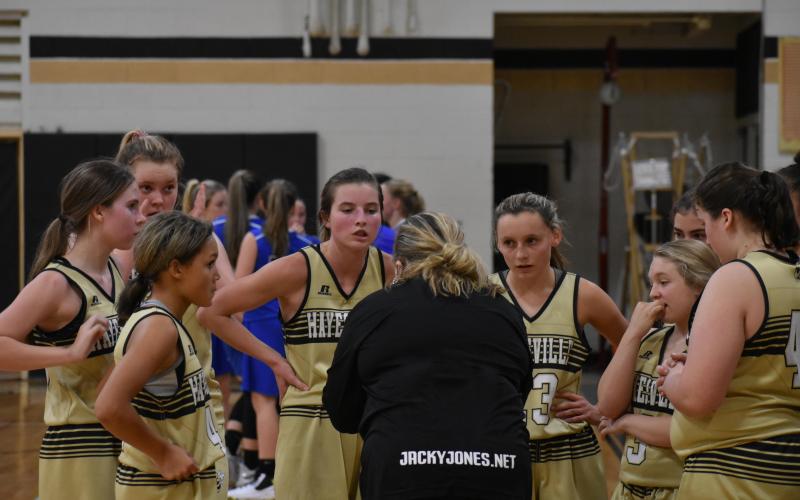 (Photo by Turner Guildrey) Coach Tammy Dills uses a timeout to go over a plan of attack with the Lady Jackets.