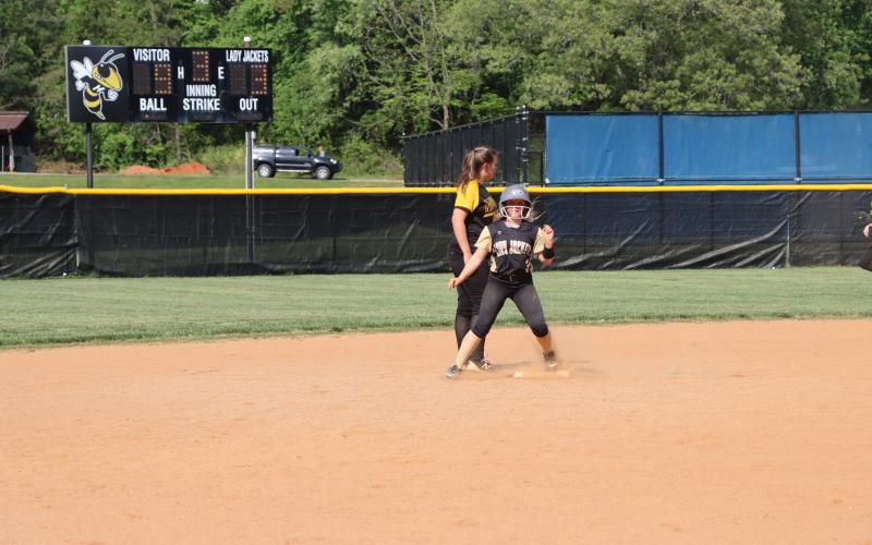 Deby Jo Ferguson • Clay County Progress Callie Long slams a two-base hit and brings it in scoring 2 runs for the Jackets.