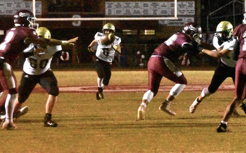 Gary Corsair • Clay County Progress Hayesville safety Logan Caldwell, No. 6, keeps his eyes on the prize as Swain County's Gabe Lillard, No. 2, pitches the ball as Yellow Jackets Lane O'Dell, No. 60, and Avery Leatherwood, No. 10, do their best to bust up the play.