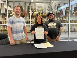 Deby Jo ferguson• Clay County Progress From left, Women’s Coach Daniel Sherlin, Lilliani Denton and dad, James Denton at the signing with Western New England Colleg.