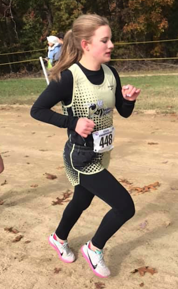 (Kelly Phillips Jones • Facebook) Caroline Bunch pounds the ground on her way to being the Lady Jackets’ second highest finisher. 