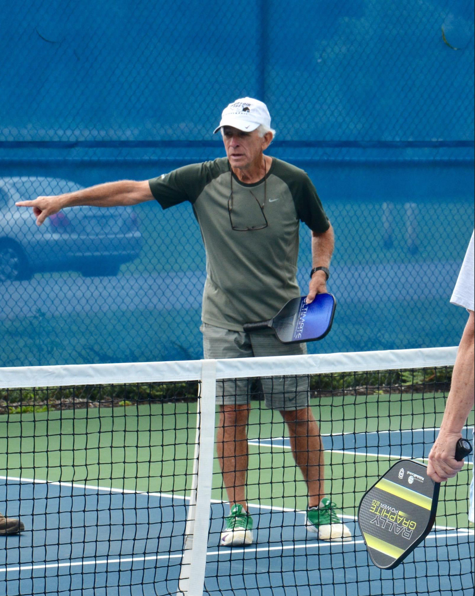 Local pickleball legend Harry Jarrett gives instructions to fellow picklballers. 