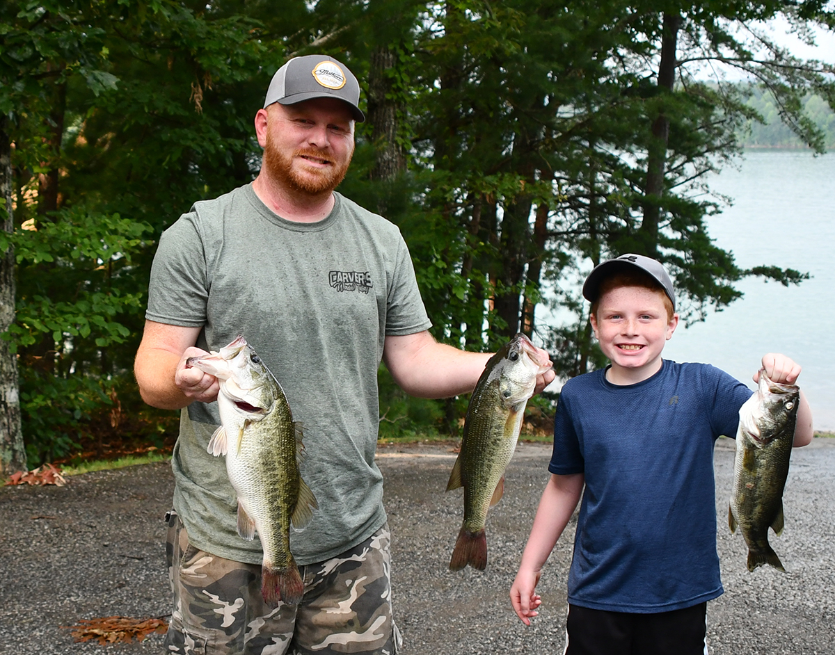 Jeremy Payne shows off some of the catch that earned him the top spot in the bass tournament. Zeke Payne came in second place in the youth division.