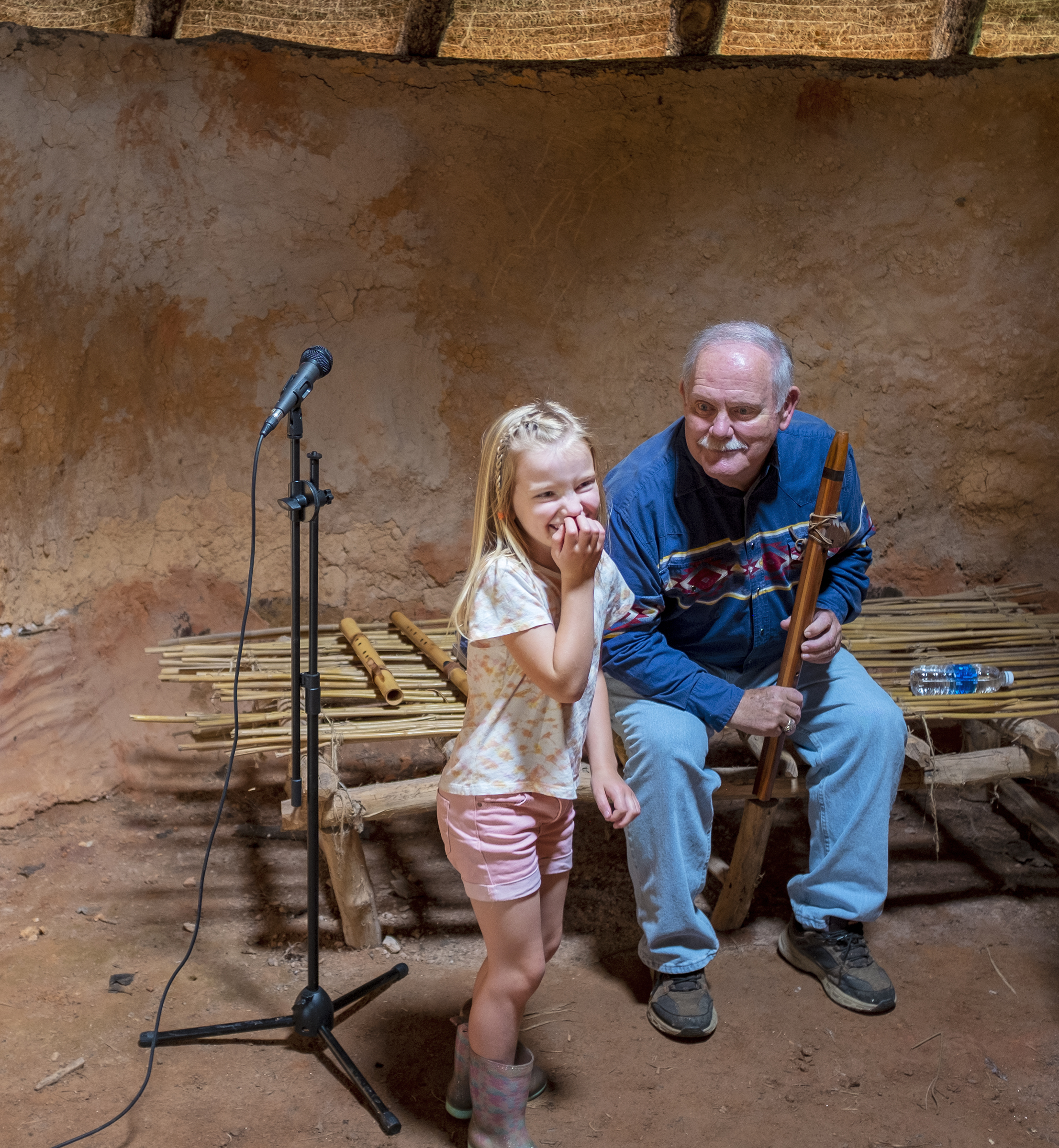 Photo David Smart Dan Hollifield plays the flute for an appreciative young friend.