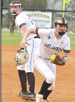 Gary Corsair • Clay County Progress Hayesville hurler Addie Bunch hustles toward first base for a putout after she and Macie Parker converged on a grounder.