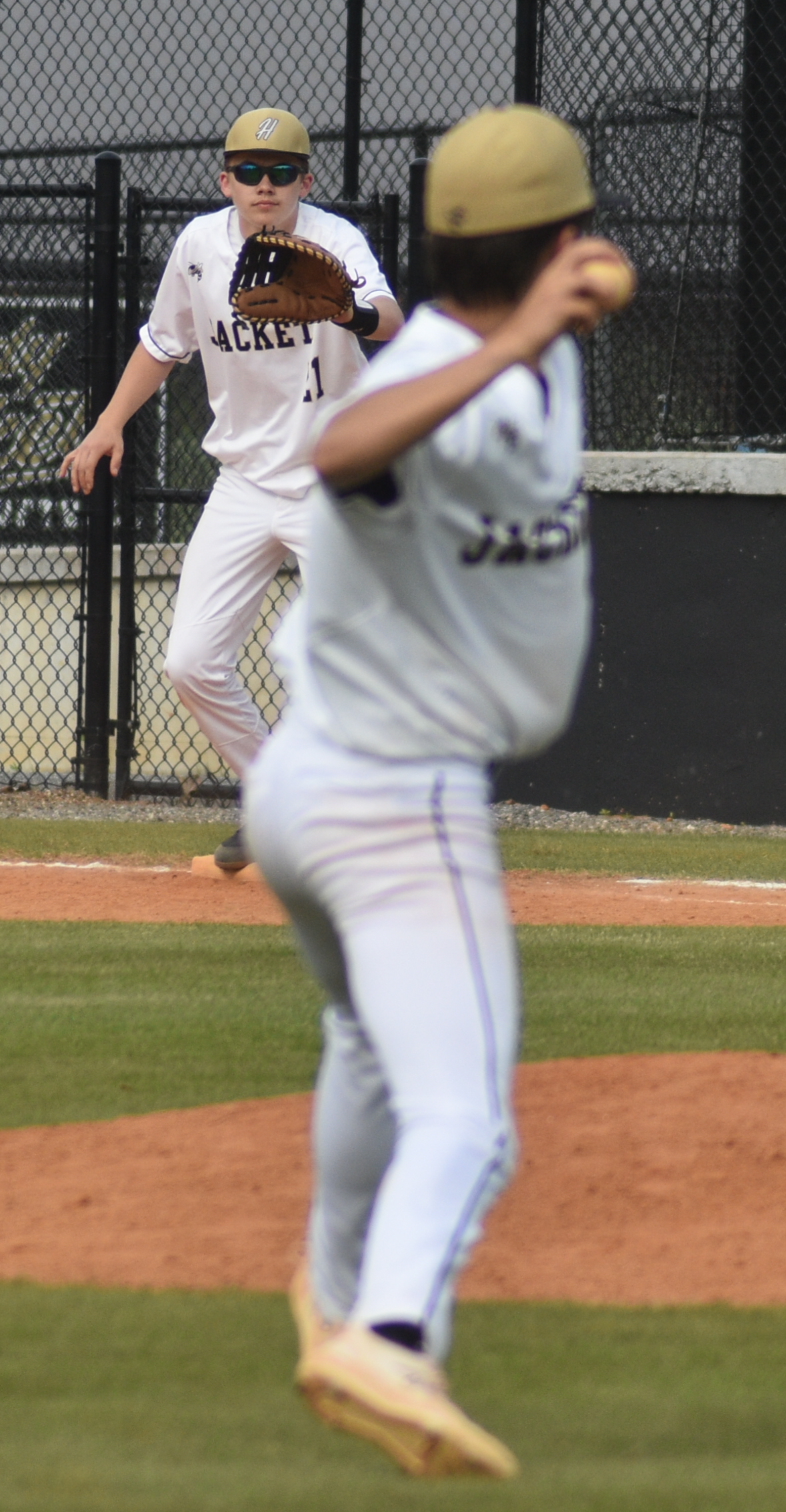 Gary Corsair • Clay County Progress Hayesville first baseman Jackson Sellers readies for a throw from third baseman Chance Hughes in the final inning of Hayesville's 16-0 rout of Cherokee.