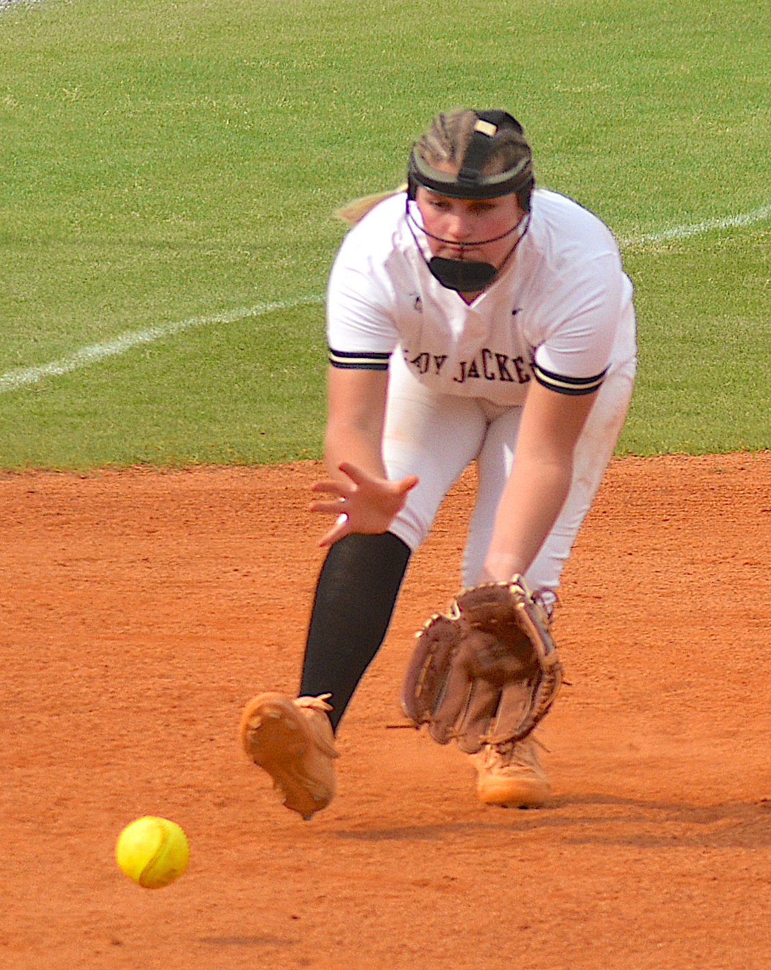 Gary Corsair • Clay County Progress Hayesville third baseman Gracelynn Anderson scoops up a hot grounder against Cherokee.