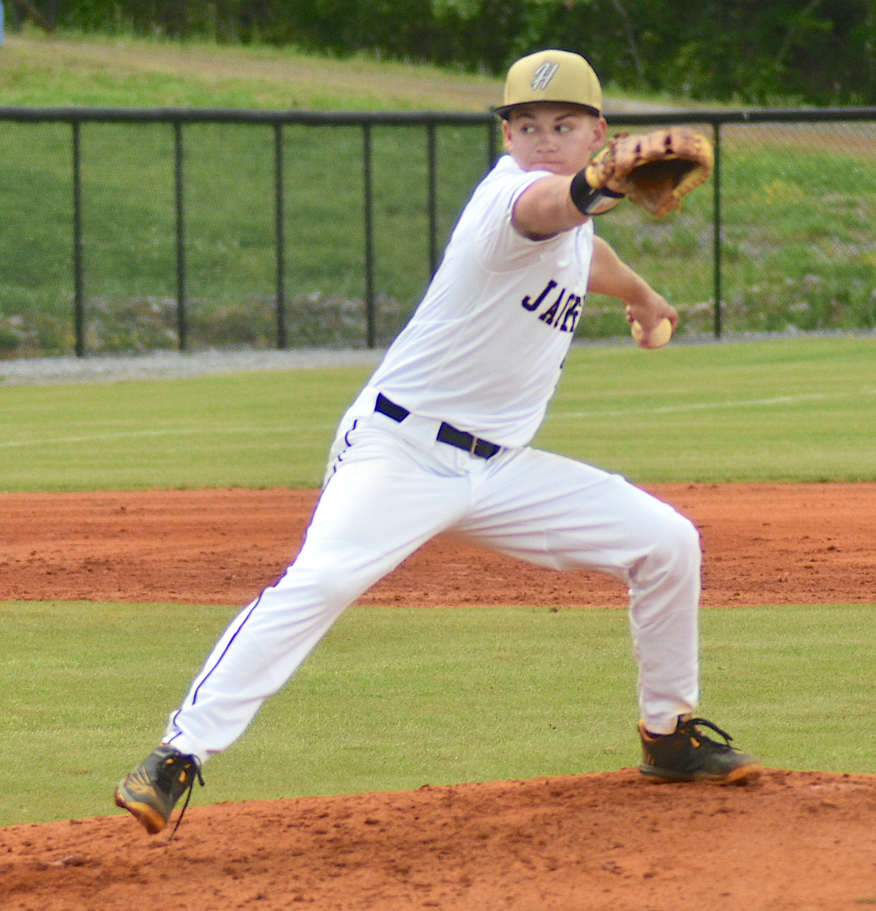 Gary Corsair • Clay County Progress Hayesville ace Braxton Cherry puts every ounce of his being into a fastball in Friday’s second round playoff game. 