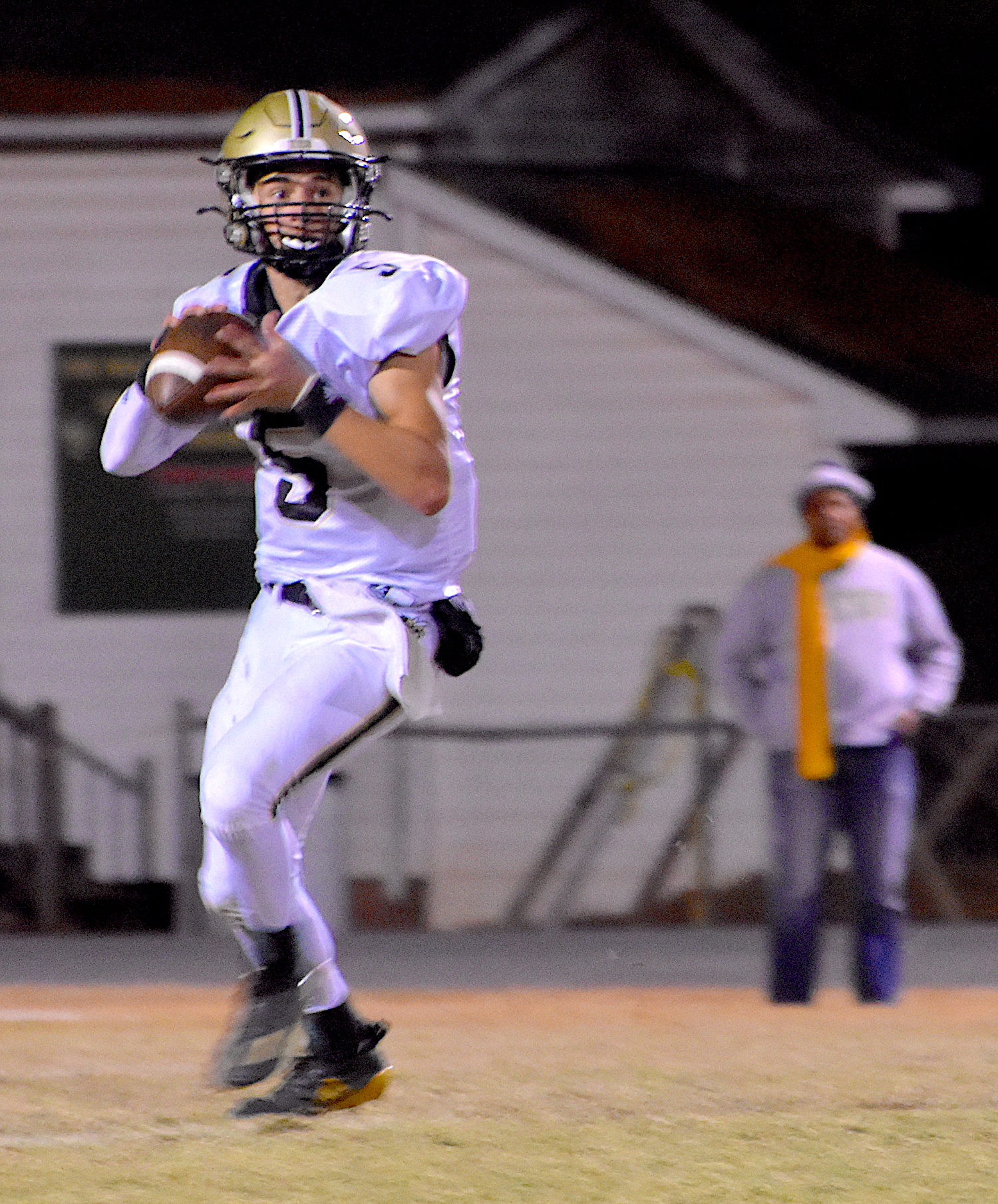 Gary Corsair • Clay County Progress Hayesville quarterback Tate Roberts, No. 5, rolls out to pass as the Yellow Jackets attempt to rally against Eastern Randolph.