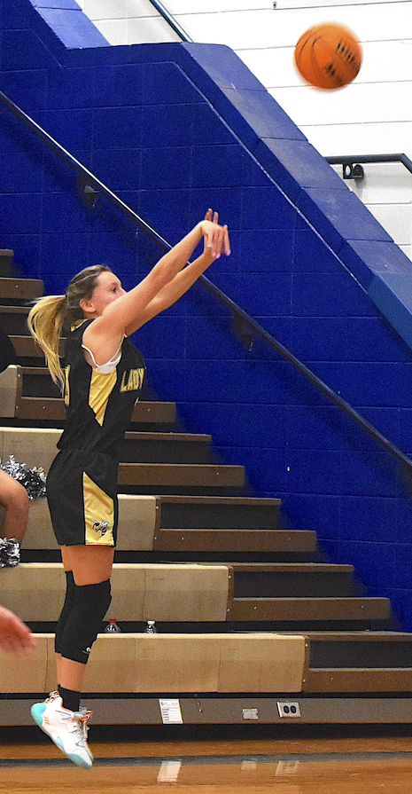Gary Corsair • Clay County Progress Hayesville sharpshooter Emma Ashe lofts one of her four three-pointers on the way to a 22-point explosion at Hiwassee Dam. 