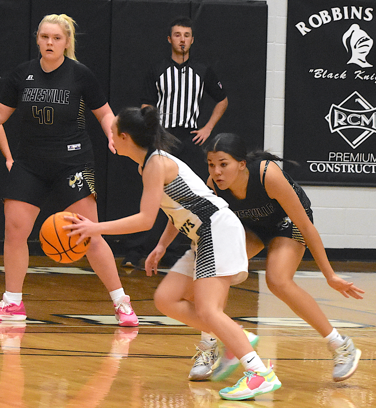 Gary Corsair • Clay County Progress Hayesville's Kylah Eller, No. 5, plays lock down defense on the ball while teammate Ava Moore, No. 40, patrols the baseline.