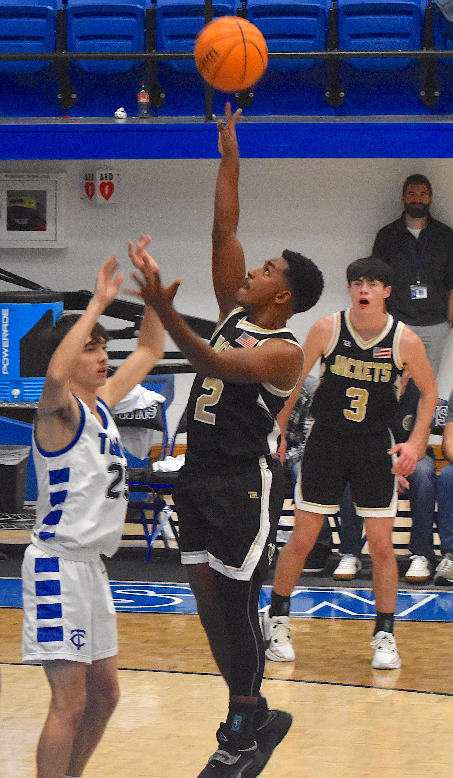 Gary Corsair • Clay County Progress Hayesville's Asher Brown, No. 2, earns the amazement of teammate Slade Crouch, No. 3, as Brown lofts a floater over a Towns County defender.