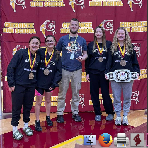 Hayesville Lady Jacket wrestlers, from left, are Lilliani Denton, Amyna Denton, Coach Daniel Sherlin, Katie Miller and Lakota Shelton. 